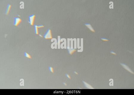 .Crystal light reflections for overlay mockup on light background. Abstract prism reflection, rays leaking through lens effect. Rainbow holographic Stock Photo