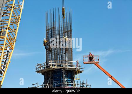 New Corpus Christi Harbor Bridge construction, technicians tying rebar, metal frame & wood decking platforms. Stock Photo