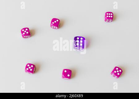 Blue and purple dices isolated on white background with a concept of gambling and chance Stock Photo