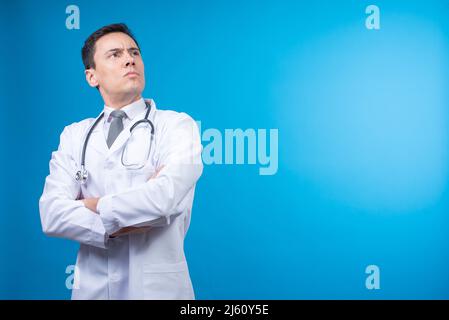 Confident doctor with arms crossed in studio Stock Photo