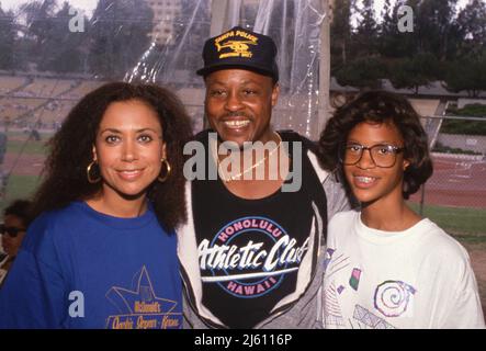 Denise Nicholas with Roger E. Mosley and his daughter Ch'a at the Jackie Joyner Kersee Invitational June 18, 1989. Credit: Ralph Dominguez/MediaPunch Stock Photo