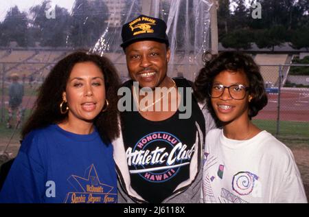 Denise Nicholas with Roger E. Mosley and his daughter Ch'a at the Jackie Joyner Kersee Invitational June 18, 1989. Credit: Ralph Dominguez/MediaPunch Stock Photo