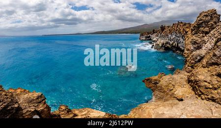 A panoramic view from the cliffs on the south side of La Perouse Bay, looking north to West Maui, Hawaii, USA. Stock Photo