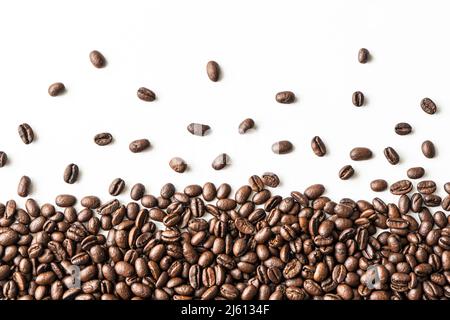 Coffee background or texture concept. Coffee beans isolated on white background with copyspace for text. Stock Photo