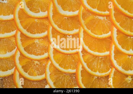 Colorful orange citrus fruit slices background top view Stock Photo