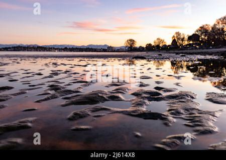 Low tide at sunset on Willows Beach, Oak Bay - Victoria, Vancouver Island, British Columbia, Canada [Shallow Depth of Field] Stock Photo