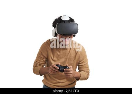 Young peruvian man playing games with joystick and vr headset, isolated. Stock Photo