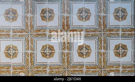 Closeup of Wall tiled with colorful ceramic tiles in village in Andalusia Stock Photo