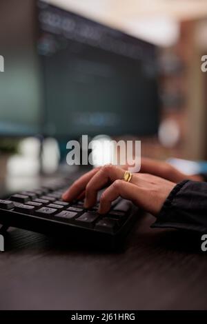 Security application engineer encrypting vital company information on blockchain system. Neural network programmer hand developing artificial intelligence data processor. Close up. Stock Photo