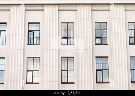 Elongated windows with columns exterior building in gray Stock Photo