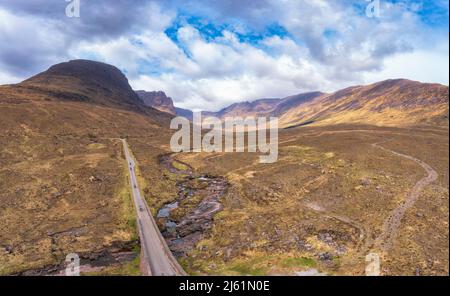 Applecross pass road passing over Russel Burn stream with mountains in background Stock Photo