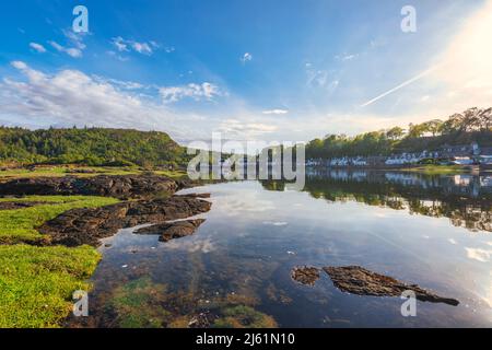 Picturesque Plockton village reflecting on lake, Scotland Stock Photo