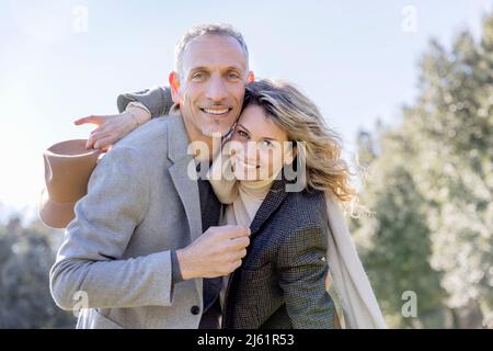 Happy mature couple embracing each other on weekend Stock Photo