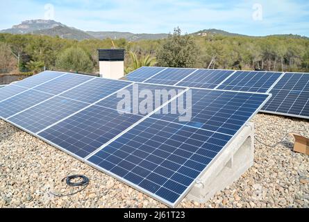 Solar panels installed on rooftop of house Stock Photo