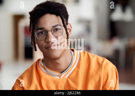 Smiling young man wearing eyeglasses Stock Photo
