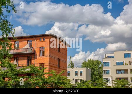Germany, Berlin, Clouds over modern apartment buildings in new development area