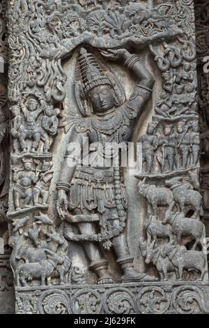 Sculpture of Lord Krishna Holding a Mount, Hoysalwswara Temple, Halebeedu, Karnataka, India Stock Photo