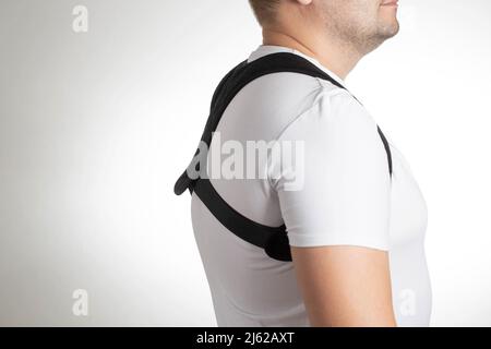 A Male is Wearing an Orthopedic Posture Corrector. Treatment for