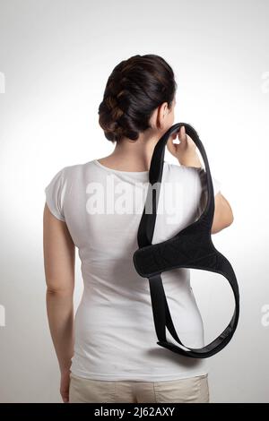 Woman in black posture corrector and fixation brace for the thoracic spine,  close-up. Treatment of chronic back pain, osteochondrosis Stock Photo -  Alamy