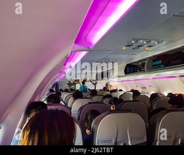 flight inside view with passenger settled at seat from top angle image is taken at igi airport new delhi india on Mar 05 2022. Stock Photo