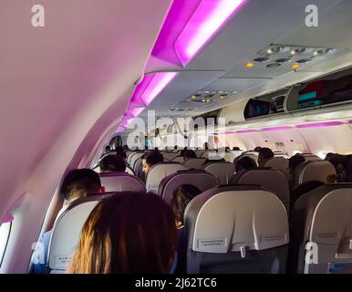 flight inside view with passenger settled at seat from top angle image is taken at igi airport new delhi india on Mar 05 2022. Stock Photo