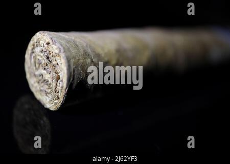Cigar on black Stock Photo