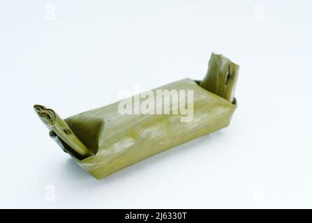 Arem-arem, Lemper, Lontong - traditional food wrapped in banana leaf on white background Stock Photo