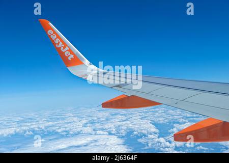 Easyjet Airbus A320-214 wing detail in flight. Stock Photo
