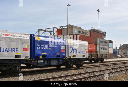 Basel, Switzerland - April 2022: Freight wagons in railway sidings in the city's port on the Rhine River Stock Photo