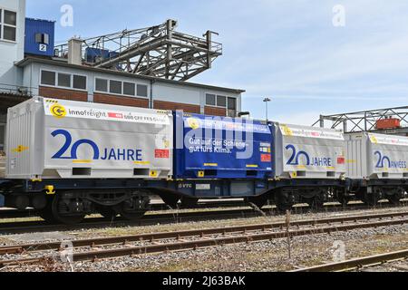 Basel, Switzerland - April 2022: Freight wagons in railway sidings in the city's port on the Rhine River Stock Photo