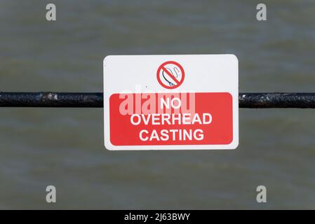 No overhead casting, warning sign to anglers on Southend Pier. Fishing restriction Stock Photo