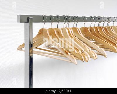 Clothes hangers on metal rail. Retail shoping sale concept Stock Photo