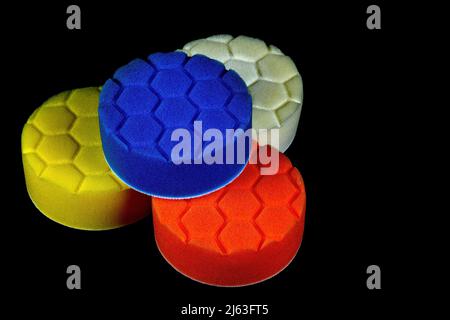 Circular plastic foam polishing pads isolated on a black background Stock Photo