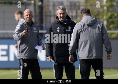 ROTTERDAM - (lr) Feyenoord trainer coach Arne Slot , Feyenoord assistant coach Marino Pusic , Feyenoord goalkeeper trainer Khalid Benlahsen during the training session prior to the match between Feyenoord and Olympique Marseille in the semifinal of the conference league at Trainingscomplex 1908 on April 27, 2022 in Rotterdam, Netherlands. ANP GERRIT VAN COLOGNE Stock Photo