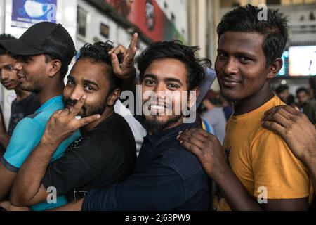 Dhaka, Bangladesh. 27th Apr, 2022. Bangladeshi people gesture as they wait in a queue to collect their tickets at Komolapur railway station as Bangladesh Railways start selling advance tickets ahead of the Eid al-Fitr holiday. Eid al-Fitr is an important religious holiday celebrated by Muslims worldwide marking the end of Ramadan, the Islamic holy month of fasting. (Photo by Sazzad Hossain/SOPA Images/Sipa USA) Credit: Sipa USA/Alamy Live News Stock Photo