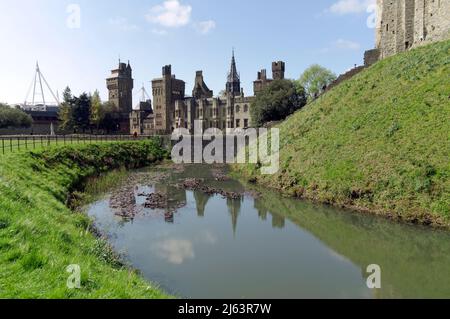 Part of Norman Keep and moat, Cardiff Castle, Spring 2022. Millennium Stadium in the distance on the left. Stock Photo