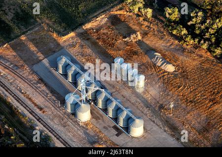 An aerial view of storage silos on a farm. Stock Photo