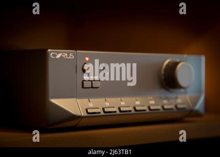 Close up of Cyrus hi-fi equipment with power standby button left on, still using electricity. Stock Photo