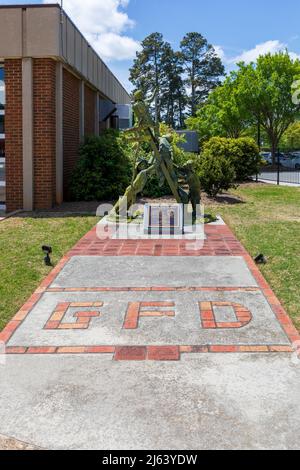 GREER, SC, USA 24 APRIL 2022: Fire Department tribute plaque and sculpture for all firefighters.  Vertical image. Stock Photo