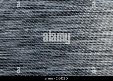Gray fabric background from textile dense material with wicker pattern, close up. Fabric structure. Fabric background. Stock Photo