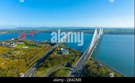 Aerial view from drone of the Three Bridges ( Queensferry Crossing, Forth Road Bridge and the Forth Bridge) that cross the Firth of Forth at North Que