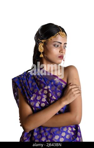 an indian girl wearing a traditional indian blue saree and simple jewellry Stock Photo