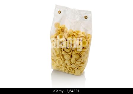 Orecchiette in transparent sealed package for sale isolated on white , Italian pasta from Puglia made with durum wheat flour and water, typical of the Stock Photo