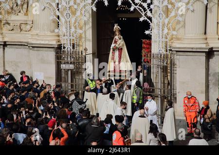 Pagani, Salerno, Italy - April 24, 2022 : Celebration of the Holy Mass in Piazza Bernardo D'Arezzo in honor of Santa Maria Incoronata del Carmine called 'Madonna delle Galline' The feast of Our Lady of the Hens is a religious and civil event that takes place annually in Pagani (Salerno) from the Friday of the eighth of Easter to the following Monday. The festival, celebrated in the homonymous sanctuary, is organized by the Carmelite Fathers of the sanctuary itself and by the Archconfraternity of Our Lady of the Hens.Outdoor celebration for the respect of the norms on Covid-19 and to avoid gath Stock Photo