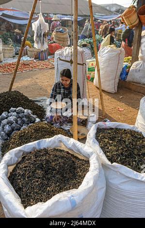 Marketplace vendor  selling tea leaves in Heho, Myanmar Burma Stock Photo