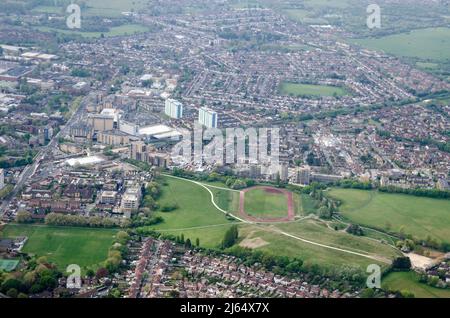 View from above of Feltham Town Centre in Hounslow, West London with the running track, part of Feltham Arenas, in the middle. Stock Photo