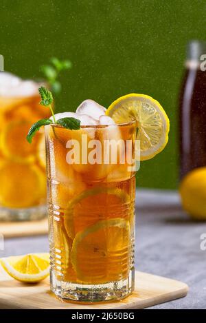 Iced tea. Traditional iced tea with lemon and ice in tall glasses Stock Photo