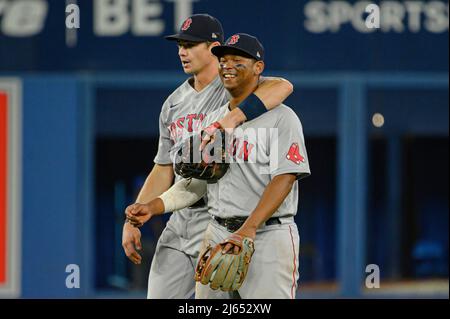 April 27, 2022, TORONTO, ON, CANADA: Boston Red Sox first baseman Bobby  Dalbec (29) and third baseman Rafael Devers (11) celebrate after defeating  the Toronto Blue Jays in MLB baseball action in