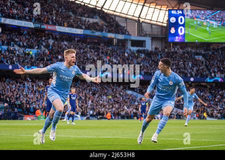 MANCHESTER, ENGLAND - APRIL 26: Kevin De Bruyne of Manchester City celebrates with Phil Foden after scoring 1st goal during the UEFA Champions League Semi Final Leg One match between Manchester City and Real Madrid at City of Manchester Stadium on April 26, 2022 in Manchester, United Kingdom. (Photo by SF) Credit: Sebo47/Alamy Live News