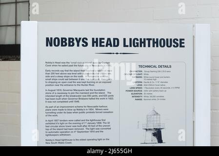 A sign explaining the history of Nobbys Lighthouse, located at the entry to Newcastle Harbour which was first lit in 1858 Stock Photo